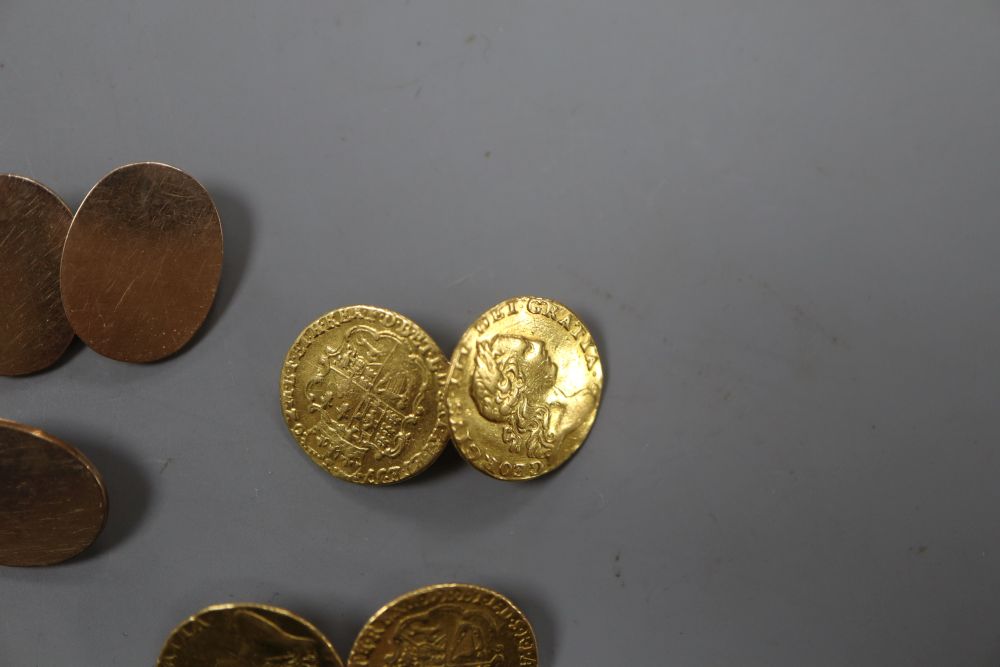 A pair of mounted George III one third guinea cufflinks, gross 10 grams and a pair of yellow metal cufflinks, 10.5 grams.